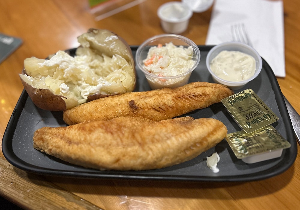 Fried Fish With Baked Potato And Sides