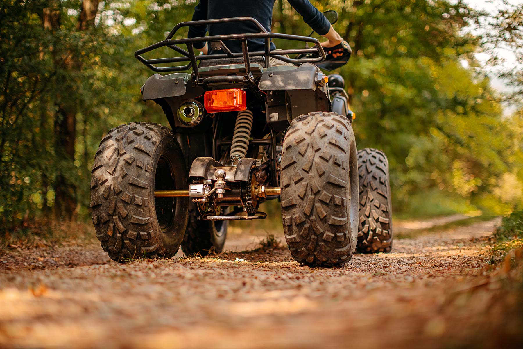 Atv On A Gravel Forest Path